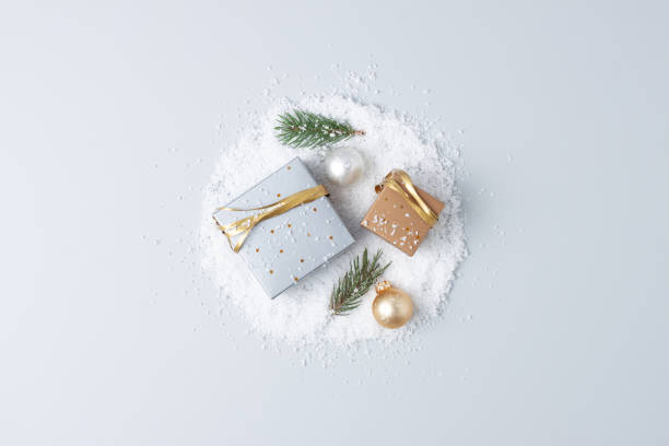 istock Christmas decorations with packaging gifts and Christmas tree on grey background. Flat lay, copy space 1333886237