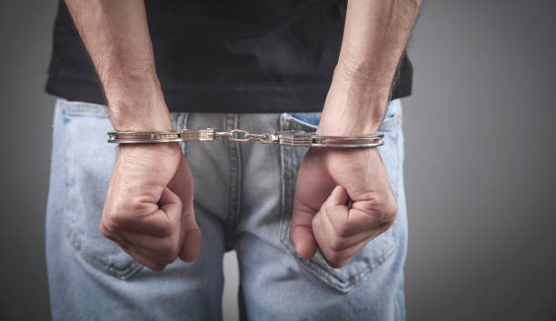 istock Caucasian male hands in handcuffs. Arrest 1333886289