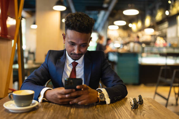 istock Businessman browsing phone on coffee break 1333887456