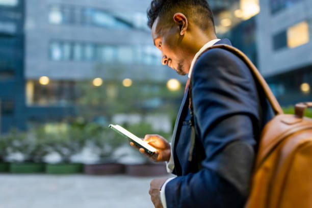 istock Businessman  rushing to the office, using phone 1333887640