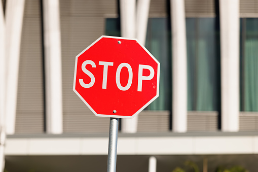 Urban stop sign in early morning
