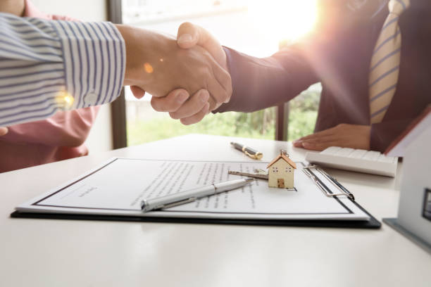 istock Real estate agent shaking hand with customer about house contract agreement.. 1333894176