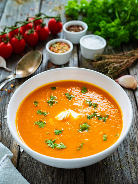 istock Cream tomato soup with cream on wooden table 1333894348