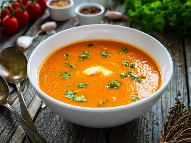 istock Cream tomato soup with cream on wooden table 1333894373