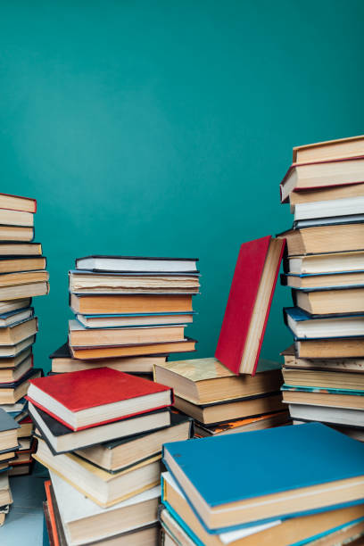 istock Stacks of books for teaching knowledge college library green background 1333894436