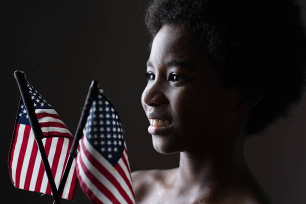istock Smile boy with American Flags. 1333898510