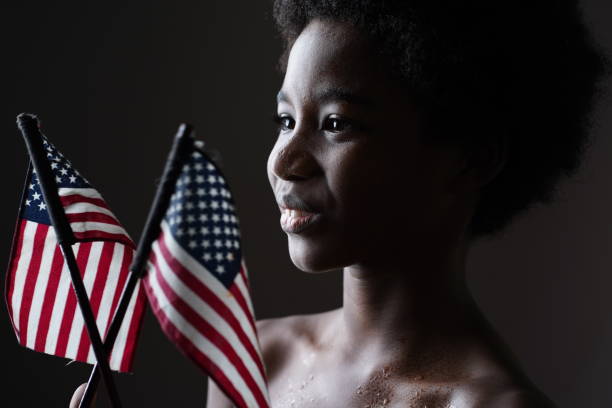 istock Smile boy with American Flags. 1333898542