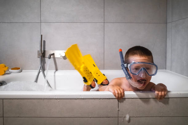 bathroom, boy, readhead, green t-shirt, shower, telephone, playing, at home