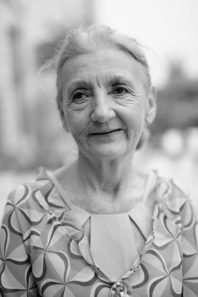 istock Senior Woman Looking Away While Standing Outdoors 1333905268