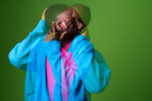 istock Man Standing Against Green Background 1333905292