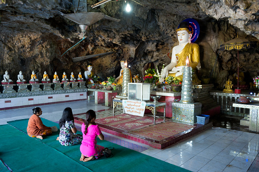Myanmar (formerly Burma). Kayin State (Karen State). Hpa Han. People praying Buddha in a Kaw Ka Taung Cave