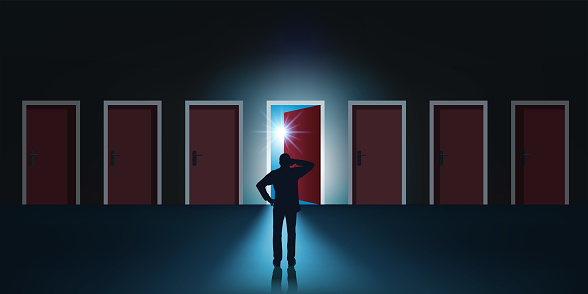 Concept of choice and opportunity for a man who is facing seven aligned doors, one of which is mysteriously open.