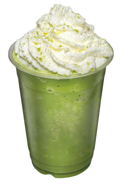istock Green Tea Smoothies mixed with whip cream topping on top isolated. 1333908683