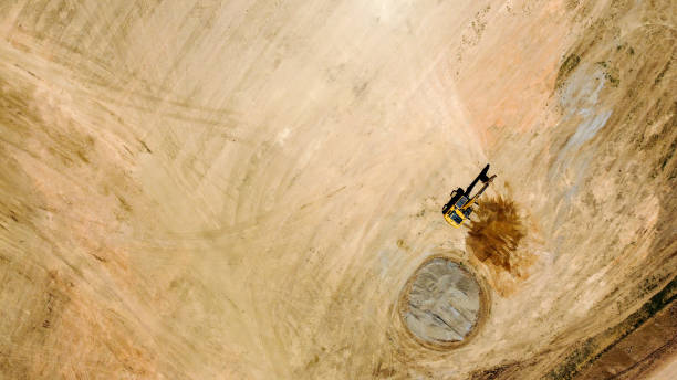 istock Backhoe or Excavator scraping a layer of soil 1333910868