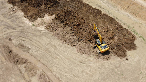 istock Backhoe or Excavator scraping a layer of soil 1333910914