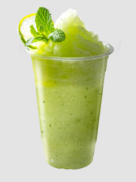 istock Smoothies mixed apple and lemon with lemon slices and mint leaves on isolated. 1333911027