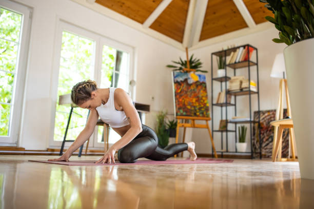 istock Woman doing yoga exercises at home 1333912332