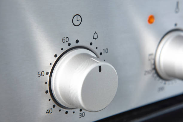 istock Oven cooking temperature control knob. Kitchen equipment panel detail 1333915241