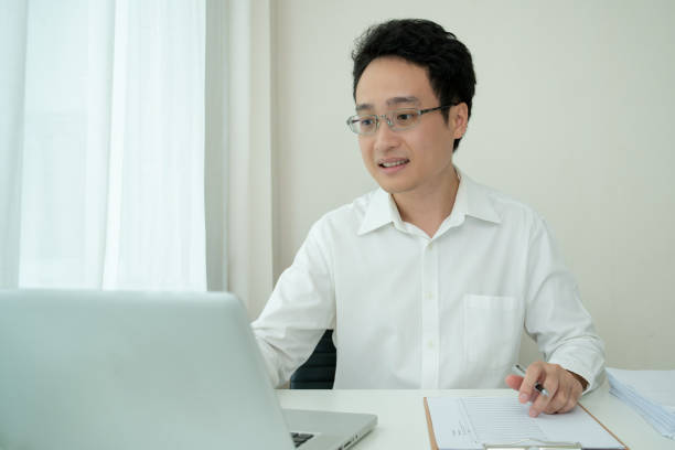istock Asian businessman working at home. 1333917623