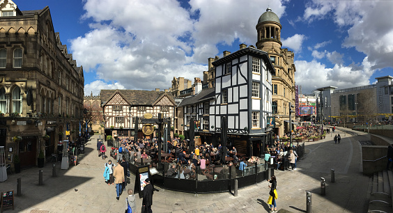 In the busy heart of Manchester in the north of England,  a group of very old buildings steeped in History.This is Shambles Square in the City a hot spot for Mancunians to meet and greet and enjoy an al fresco meal and drink.The word 