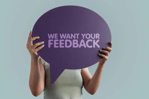 Photo of We want your feedback word with speech bubble