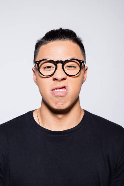 istock Angry asian young man in black clothes 1333923845