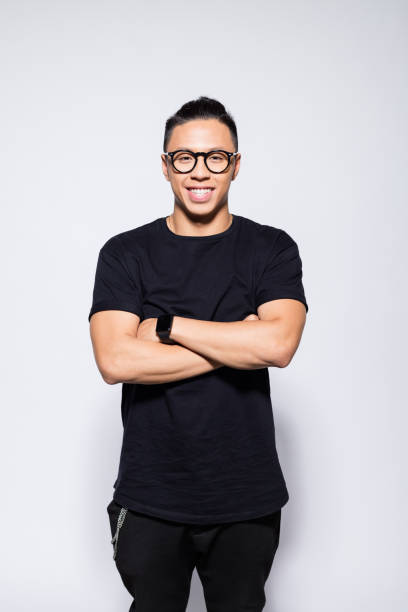 istock Cheerful asian young man in black clothes 1333923931