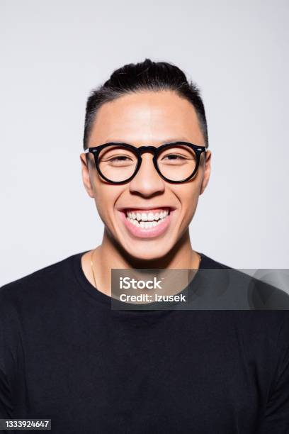 Excited Asian Young Man In Black Clothes Stock Photo - Download Image Now - Ecstatic, Excitement, One Person