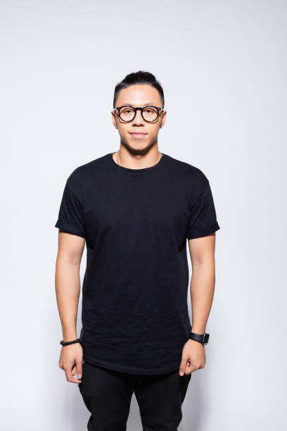 istock Friendly asian young man in black clothes 1333924815