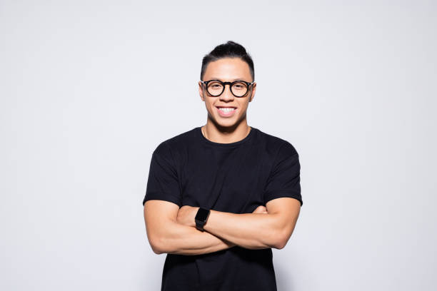 istock Friendly asian young man in black clothes 1333924873