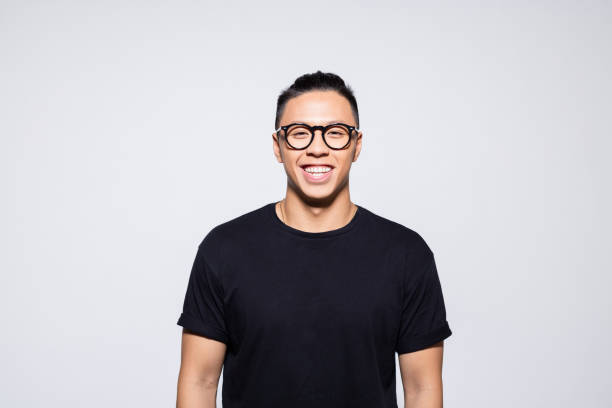 istock Happy asian young man in black clothes 1333924918