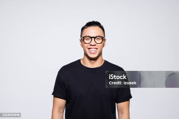 Happy Asian Young Man In Black Clothes Stock Photo - Download Image Now - 20-24 Years, Adult, Adults Only