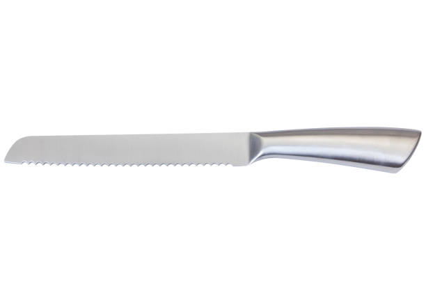 High-quality, high-durable stainless steel serrated bread knife, isolated on white with clipping path. High-quality, high-durable stainless steel serrated bread knife, isolated on white with clipping path. serrated stock pictures, royalty-free photos & images