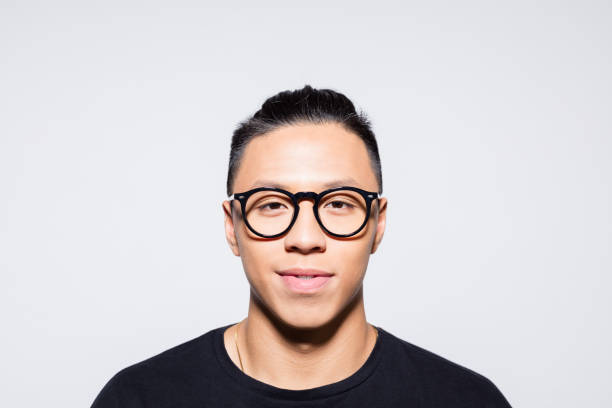 istock Happy asian young man in black clothes 1333924971