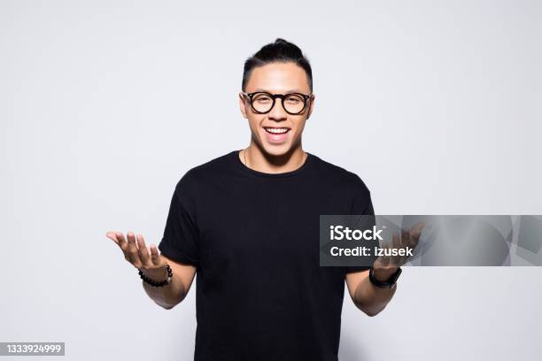 Happy Asian Young Man In Black Clothes Stock Photo - Download Image Now - Men, Portrait, Asian and Indian Ethnicities