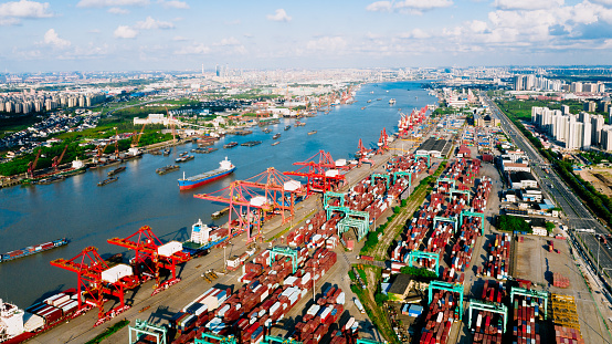 Aerial view container ship loading and unloading.