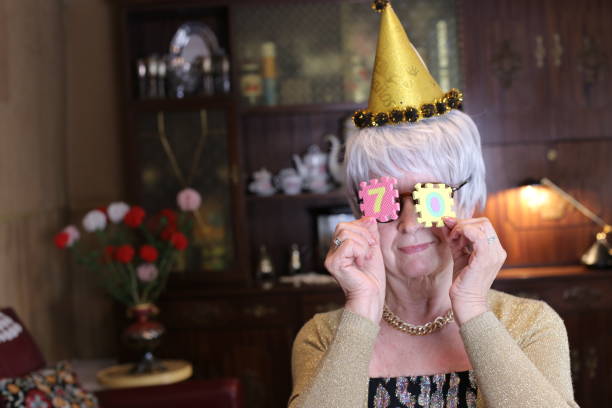 istock Senior woman celebrating 70th anniversary with joy 1333928429