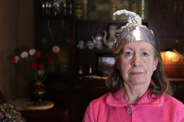 istock Senior conspiracy theorist wearing weird hat 1333928502