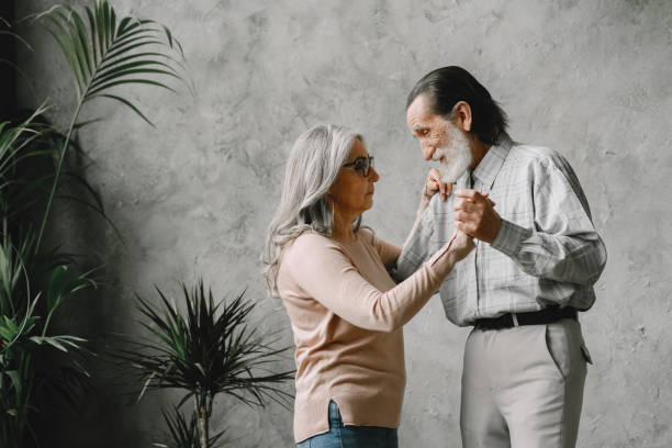 istock The happy elderly woman and a man dancing 1333928598