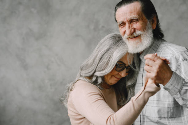 istock The happy elderly woman and a man dancing 1333928657