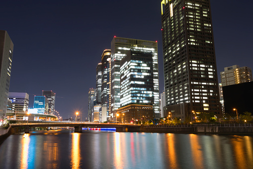 Night view of buildings in Fukushima Ward, Osaka City and reflection on the river