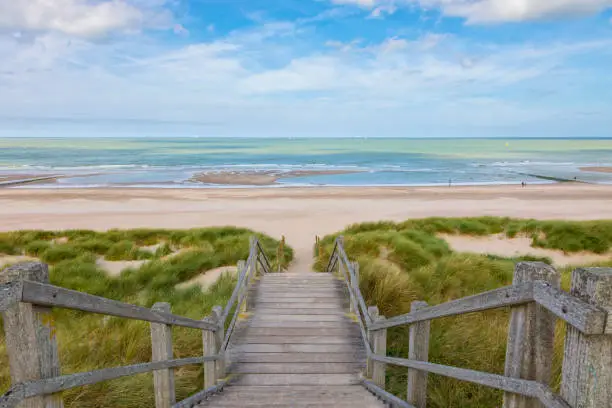 Wooden stairs through the dunes down to the North Sea beach at Blankenberge, Belgium
