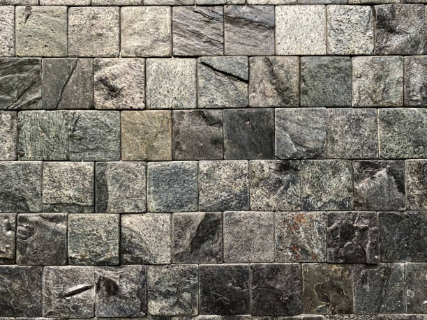 istock Marble tile on the wall. Light reflect on surface which is swell texture. rough textured inside square shape background. 1333934440