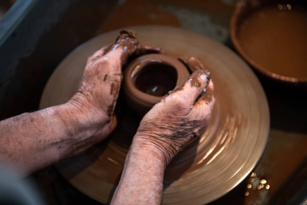 istock Woman working on pottery wheel 1333937491