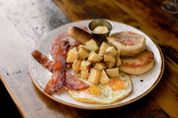 istock Breakfast Plate with Sausage, Potatoes, Bacon, and Eggs 1333938250