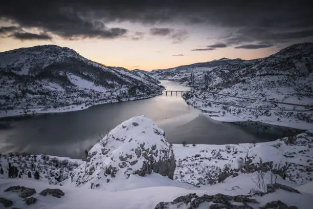 Barrios de Luna reservoir snowed at sunrise in Los Barrios de Luna, CL, Spain