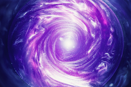 Simulation of a spiral galaxy using water and  spinning metallic particles.