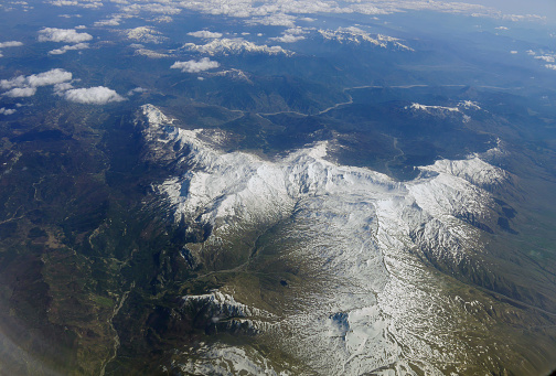 Alps mountain covered by white snow view from airplane