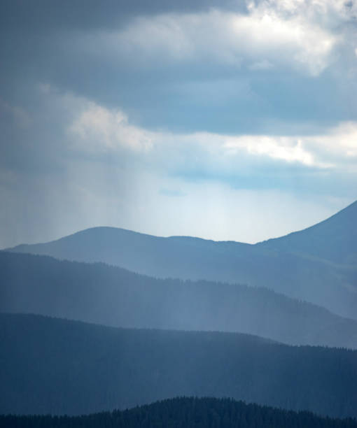 istock Sun rays and rain in the carpathian mountains in summer 1333943090