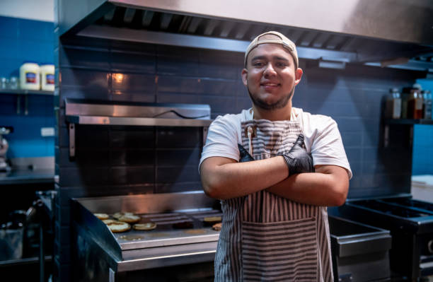 istock Happy cook working at a fast food restaurant 1333944287